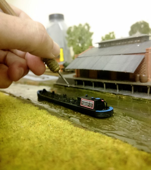 Handcrafted miniature river scene, an example of the scenery and weathering techniques covered on Model Railway Engineer